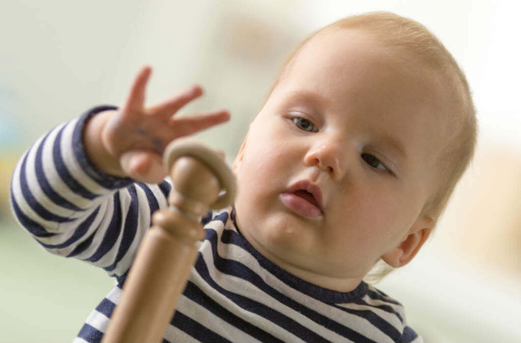 Child focusing on toy
