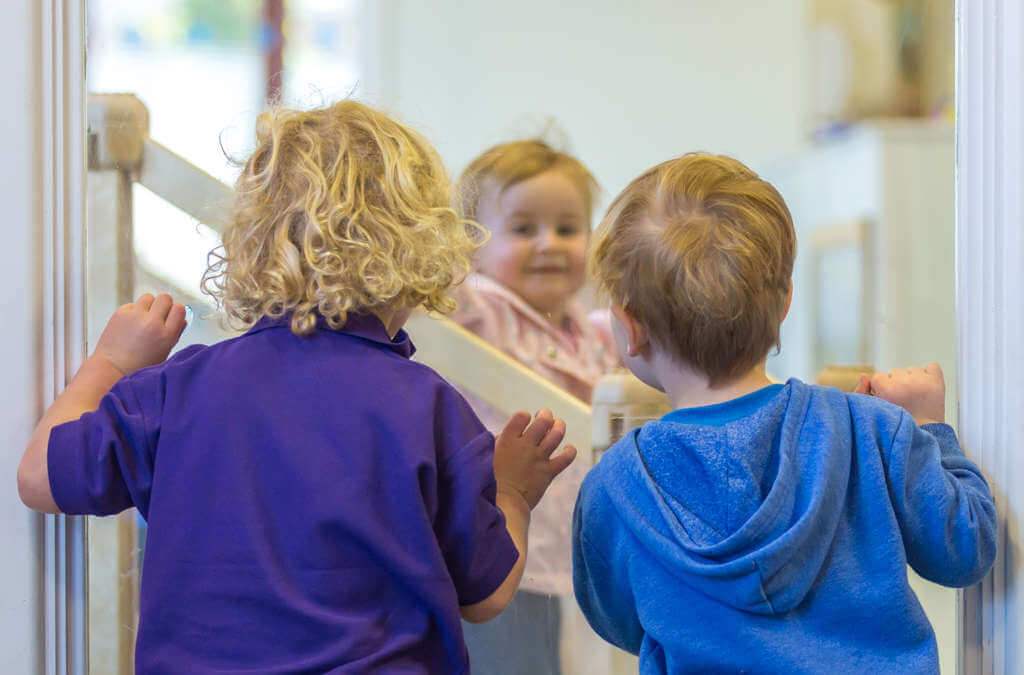 Children playing on wooden support