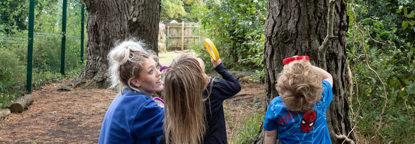 Children stand outside with nursery staff admiring the views